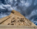 Low angle view of the western side of the limestone sculptures of pioneer navigators at the Monument to the Discoveries in Lisbon