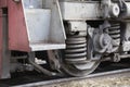 Low angle view of wheel mechanism of modern train locomotive on tracks. Steampunk, techno concept. Railroad transport, travelling Royalty Free Stock Photo