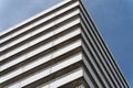 Low-angle view of a white building against a blue sky background Royalty Free Stock Photo