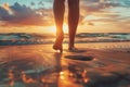 Low angle view of womans feet walking on a sandy beach on sunset Royalty Free Stock Photo