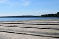 Low angle view of wooden pier. Lake on background. Royalty Free Stock Photo