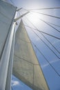 Low angle view of yacht sails and mast against sky