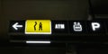 Yellow Illuminated Toilet Sign and Other Symbols