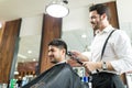 Professional Barber Trimming Client`s Hair In Salon