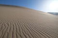 Wide sand dune under bright sunshine Royalty Free Stock Photo