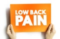 Low Back Pain - acute, or short-term back pain lasts a few days to a few weeks, text concept on card for presentations and reports Royalty Free Stock Photo