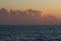 Low bank of misty cloud behind offshore wind turbines. Spiritual landscape