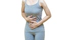 Low body of a woman in gray clothes put her hands on the Stomach area at spot of ache, abdominal pain, Health-care concept on Royalty Free Stock Photo