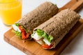 Low Calorie Diet Wrap with Cheese, Tomatoes, Salad and Orange Juice Royalty Free Stock Photo