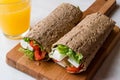 Low Calorie Diet Wrap with Cheese, Tomatoes, Salad and Orange Juice Royalty Free Stock Photo