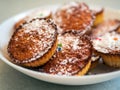 Low calorie gluten and lactose free cornmeal muffins with raisins and fructose sprinkle on a white plate. Healthy vegetarian