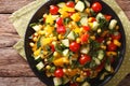 Low calorie salad of corn, tomatoes, cucumbers and pepper closeup. horizontal top view