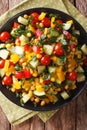 Low calorie salad of corn, tomatoes, cucumbers and pepper closeup. vertical top view