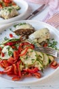 Low carb dinner or lunch with a fresh mediterranean salad and meatballs or burger on plate Royalty Free Stock Photo