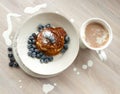 Low Carb Keto Diet Pancakes from almond coconut flour with blueberries, cream and cup of cocoa