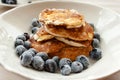 Low Carb Keto Diet Pancakes from almond coconut flour with blueberries on white plate