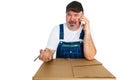 Low class manual worker talking on a mobile Royalty Free Stock Photo