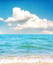 low clouds in blue sky over sea and sand beach Royalty Free Stock Photo