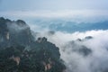 Low clouds engulfing stone pillars of Tianzi mountains in Zhangjiajie