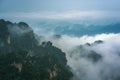 Low clouds engulfing stone pillars of Tianzi mountains in Zhangjiajie