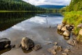 Low Clouds and Forested Shoreline Reflection on The Still Waters of Trillium Lake