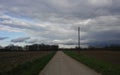 Low clouds looking east down country road Royalty Free Stock Photo