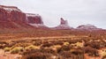 Low clouds over Eagle Mesa, Setting Hen, and Sleeping Bear at Monument Valley, Navajo Nation Royalty Free Stock Photo