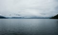 Low clouds over water in Hardangerfjord, Norway.