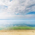 Low clouds in sky over river. Green algae in water. Eco environmental view Royalty Free Stock Photo