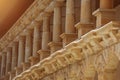 Low columns of orange limestone stone, elements of external architecture Royalty Free Stock Photo