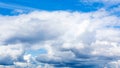 low cumulus white clouds in blue sky on summer day