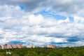 low dense white clouds in blue sky over city Royalty Free Stock Photo