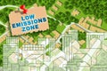 Low Emissions Zone - Net-Zero Emission and Carbon Neutrality concept against an imaginary city map