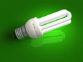 Low-energy lamp over green Royalty Free Stock Photo