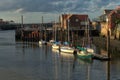 Yachts moored in Whitby harbour before sunset.