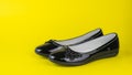 Low fashion women`s shoes on a yellow background. Royalty Free Stock Photo