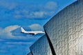 Low flying airplane over the thames barriers Royalty Free Stock Photo