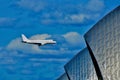 Low flying airplane over the thames barriers Royalty Free Stock Photo