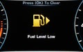 Low Fuel. A car s gas gauge showing low on fuel. Sensor fuel warning on digital dashboard. Low fuel level Royalty Free Stock Photo