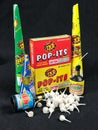 Low Grade hand held fireworks like Pop Its and Party Poppers on a black backdrop Royalty Free Stock Photo