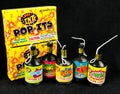 Low Grade hand held fireworks like Pop Its and Party Poppers on a black backdrop Royalty Free Stock Photo