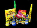 Low Grade hand held fireworks like Pop Its and Party Poppers on a black backdrop Royalty Free Stock Photo