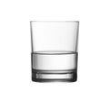 Low half full glass of water isolated with clipping path Royalty Free Stock Photo