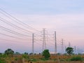 Low of high voltage transmission towers with power line over twilight sky background the electricity infrastructure