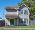 Low Income House with Green Door