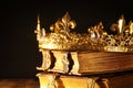 low key of beautiful queen/king crown on old books. vintage filtered. fantasy medieval period Royalty Free Stock Photo
