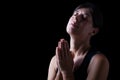 Faithful woman praying and feeling the presence or being touched by god Royalty Free Stock Photo
