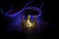 low key image of beautiful kings crown over wooden table. vintage filtered. fantasy medieval period. Selective focus Royalty Free Stock Photo