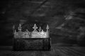 Low key image of beautiful queen/king crown on old book. vintage filtered. fantasy medieval period. black and white Royalty Free Stock Photo
