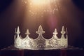 low key image of beautiful queen/king crown over wooden table. vintage filtered. fantasy medieval period Royalty Free Stock Photo